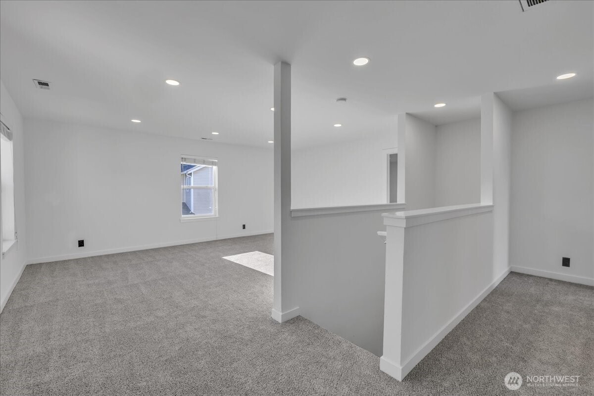 414 Easy Street Rainier, WA 98576 - Photo 13 of 38 a view of an empty room with a fireplace