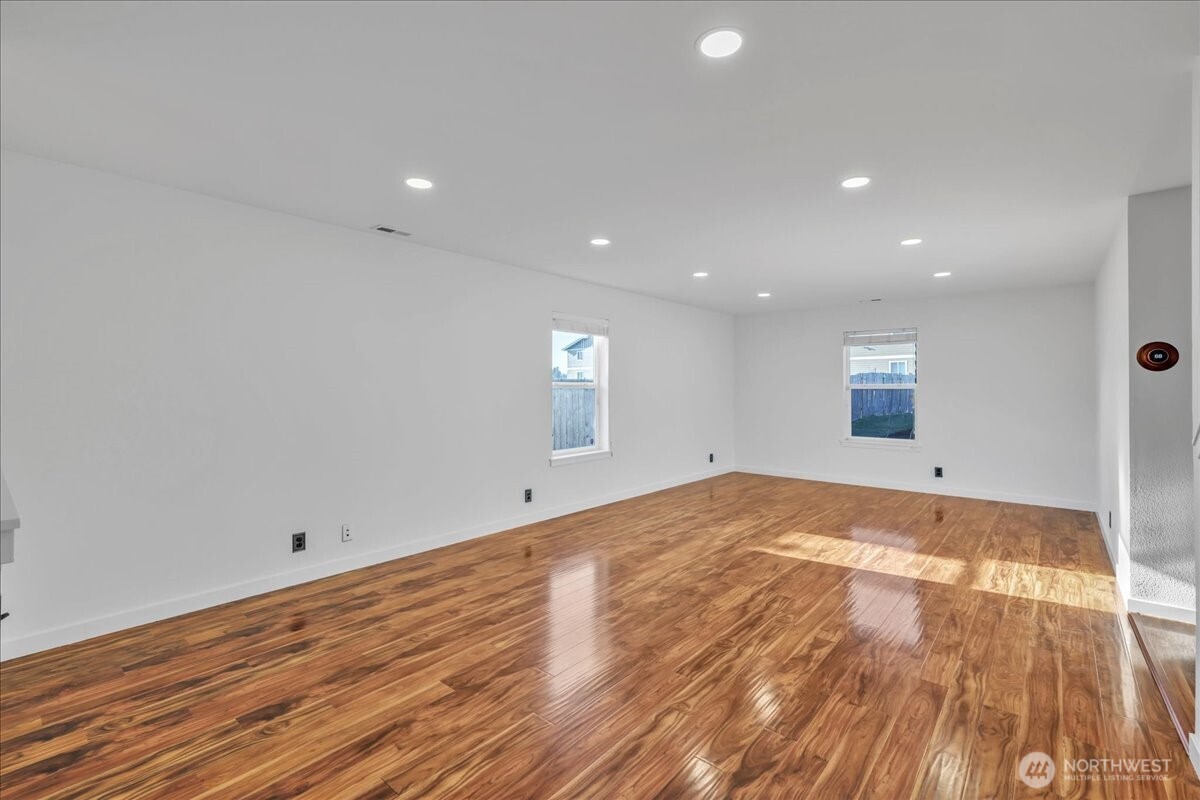 414 Easy Street Rainier, WA 98576 - Photo 17 of 38 a view of empty room with wooden floor and fan