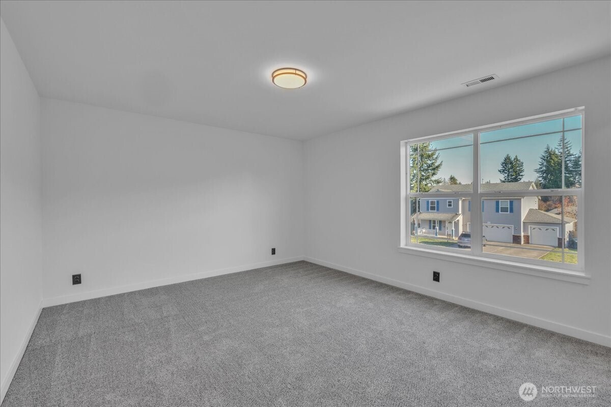 414 Easy Street Rainier, WA 98576 - Photo 21 of 38 an empty room with windows