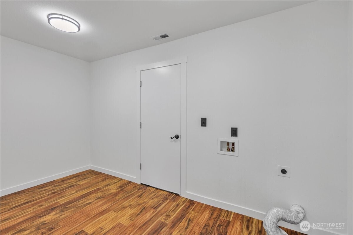 414 Easy Street Rainier, WA 98576 - Photo 31 of 38 a view of room with wooden floor