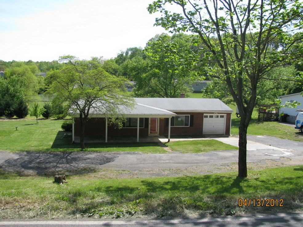 2449 Rutrough Road Southeast Roanoke, VA 24014 - Photo 1 of 11 a view of a house with backyard and a tree