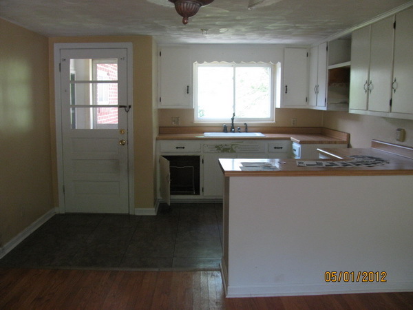 2449 Rutrough Road Southeast Roanoke, VA 24014 - Photo 4 of 11 a kitchen with granite countertop a sink stove and cabinets