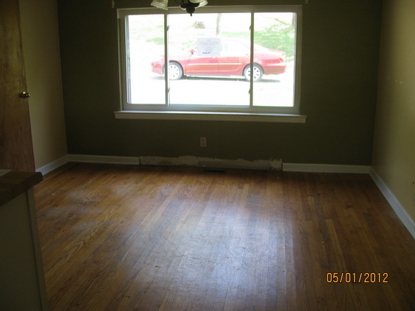 2449 Rutrough Road Southeast Roanoke, VA 24014 - Photo 5 of 11 an empty room with wooden floor and windows