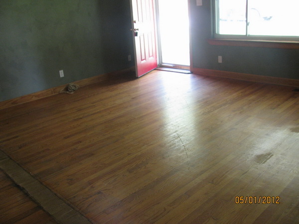 2449 Rutrough Road Southeast Roanoke, VA 24014 - Photo 7 of 11 an empty room with wooden floor and windows with curtains