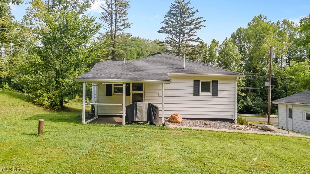 282 Johnson Road Wadsworth, OH 44281 - Photo 45 of 50 Rear view of house with a lawn
