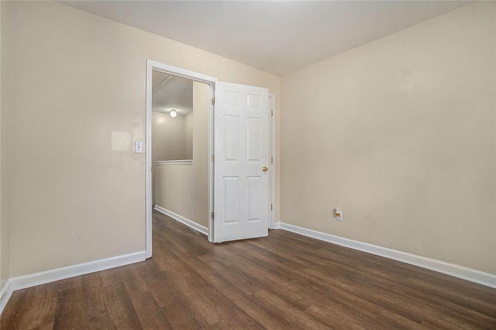 734 Celeste Lane, Unit 84 Atlanta, GA 30331 - Photo 17 of 34 an empty room with wooden floor