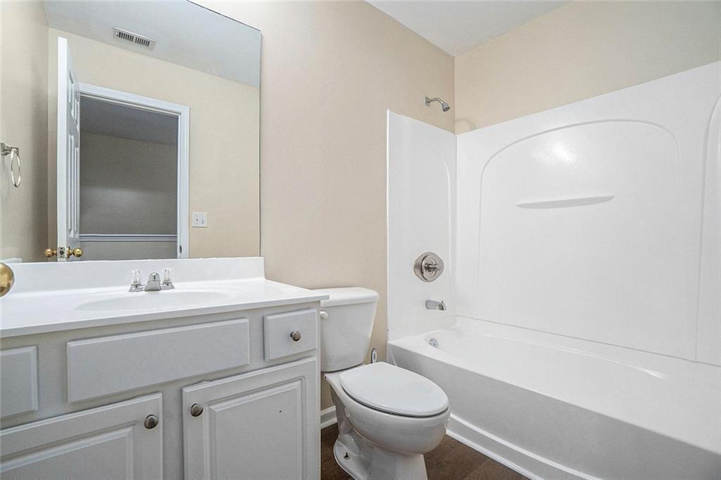 734 Celeste Lane, Unit 84 Atlanta, GA 30331 - Photo 19 of 34 a bathroom with a sink toilet vanity and tub