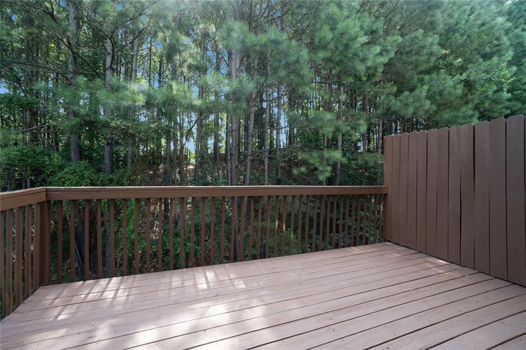 734 Celeste Lane, Unit 84 Atlanta, GA 30331 - Photo 20 of 34 a balcony with wooden floor and fence