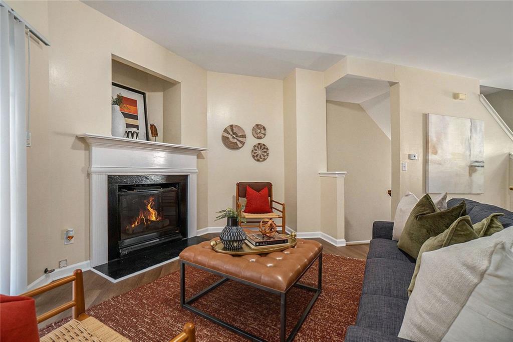 734 Celeste Lane, Unit 84 Atlanta, GA 30331 - Photo 7 of 34 a living room with furniture and a fireplace