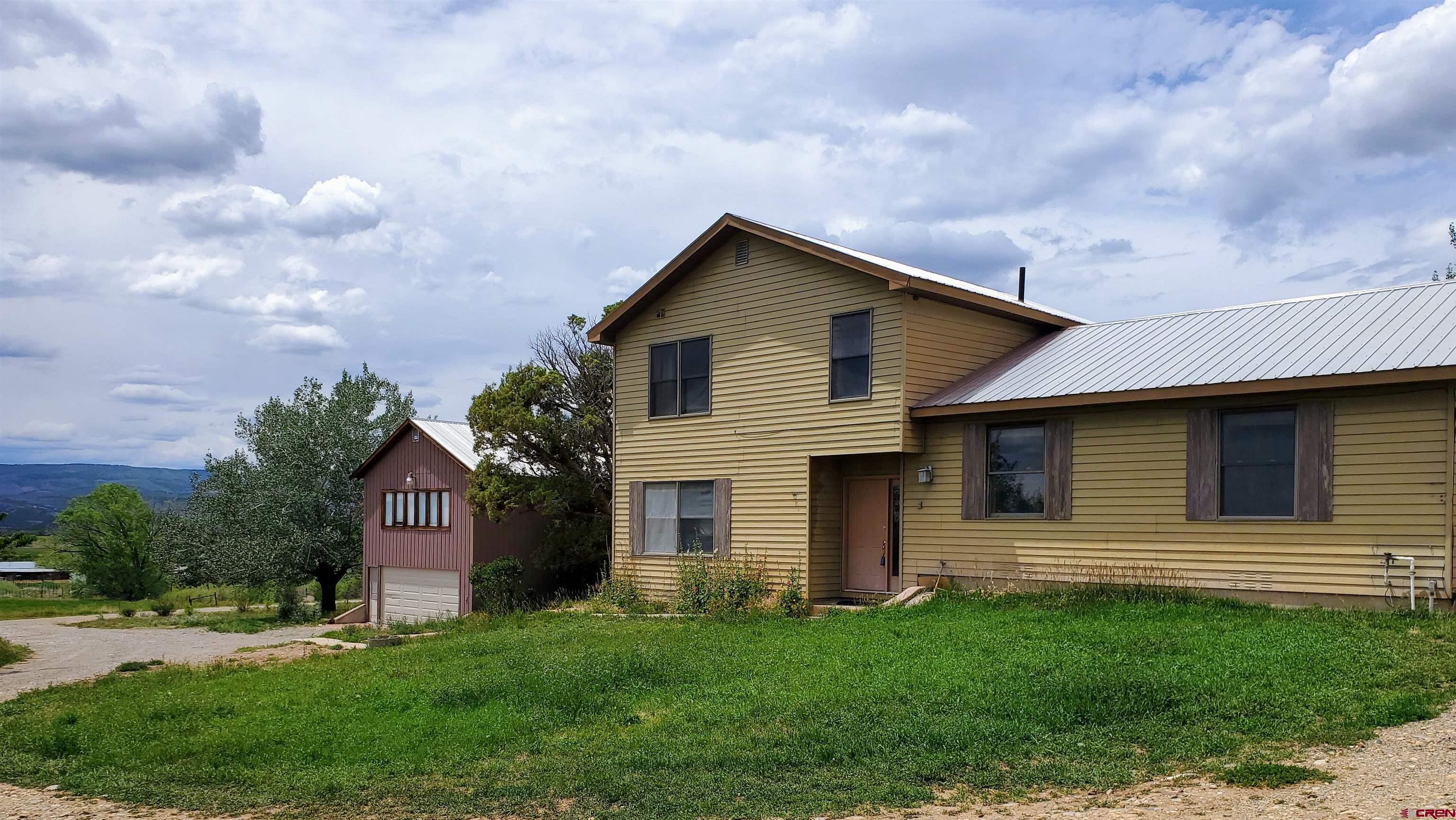 79 Cedar Circle Durango, CO 81303 - Photo 1 of 30 a front view of house with yard and green space