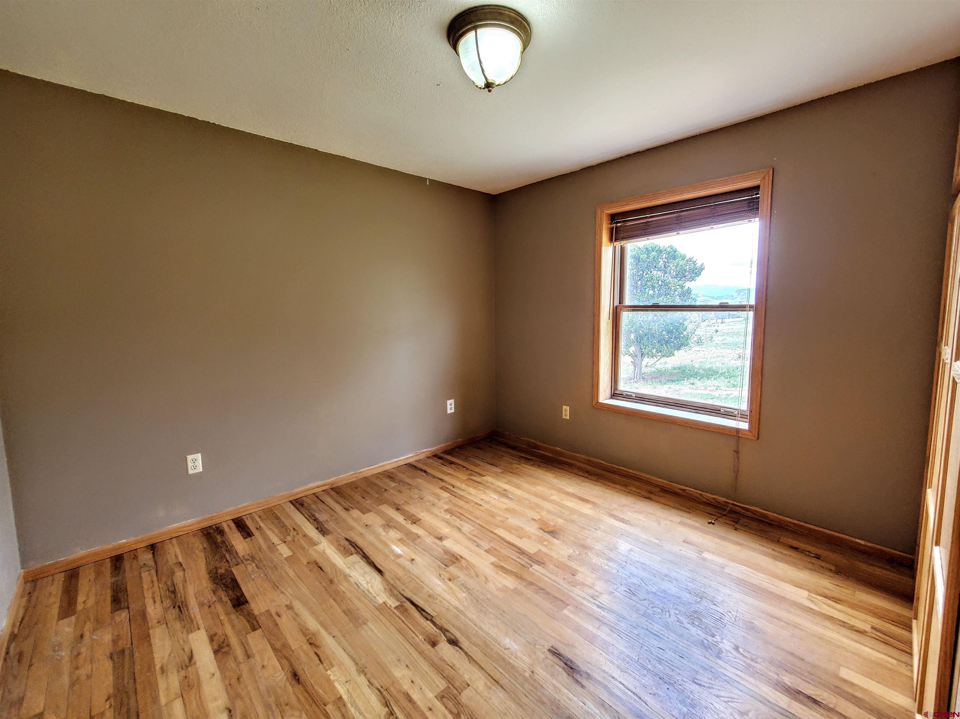 79 Cedar Circle Durango, CO 81303 - Photo 25 of 30 a view of an empty room and window