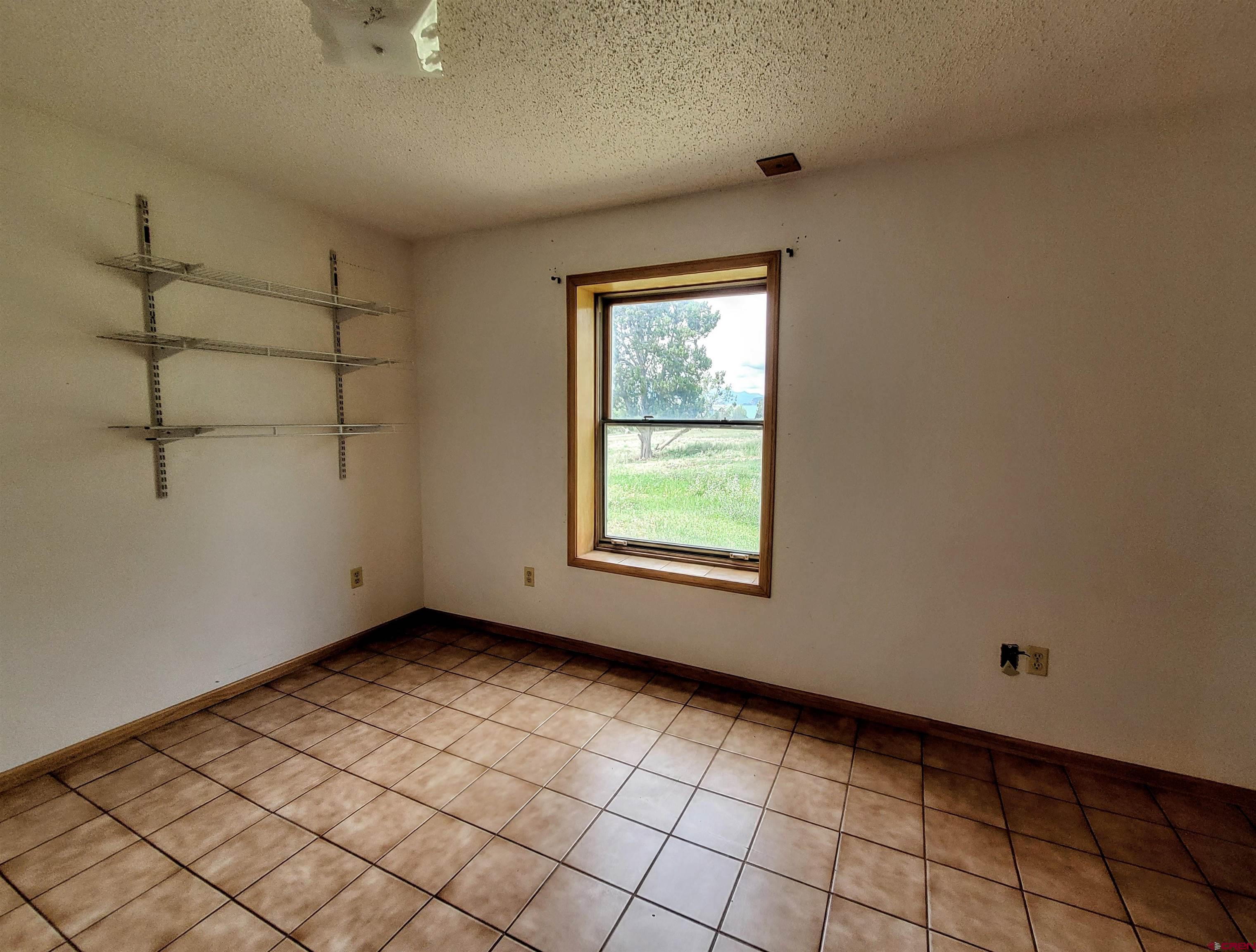 79 Cedar Circle Durango, CO 81303 - Photo 29 of 30 a view of an empty room with a window