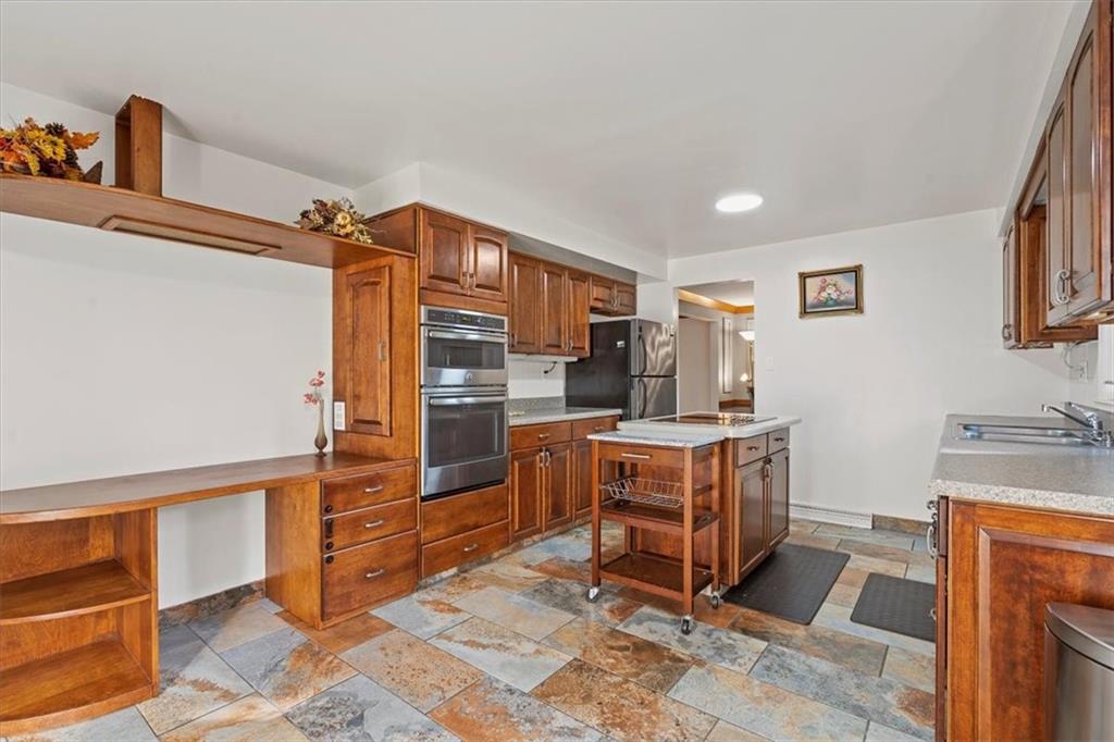 2239 Old Washington Road Pittsburgh, PA 15241 - Photo 18 of 37 a kitchen with stainless steel appliances granite countertop a stove and a refrigerator