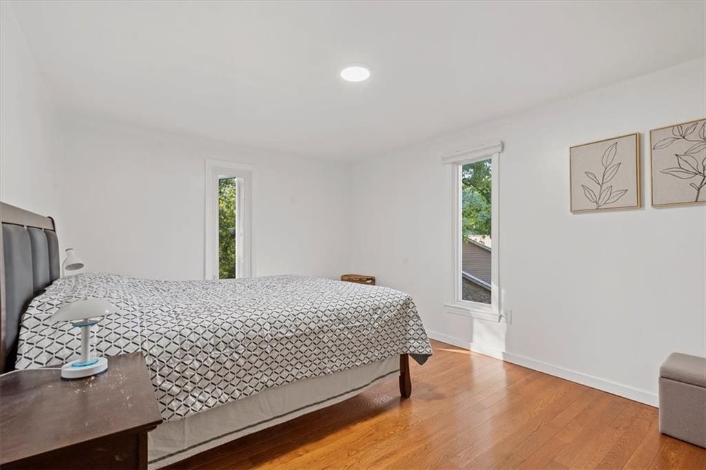 2239 Old Washington Road Pittsburgh, PA 15241 - Photo 23 of 37 a bedroom with a bed and wooden floor
