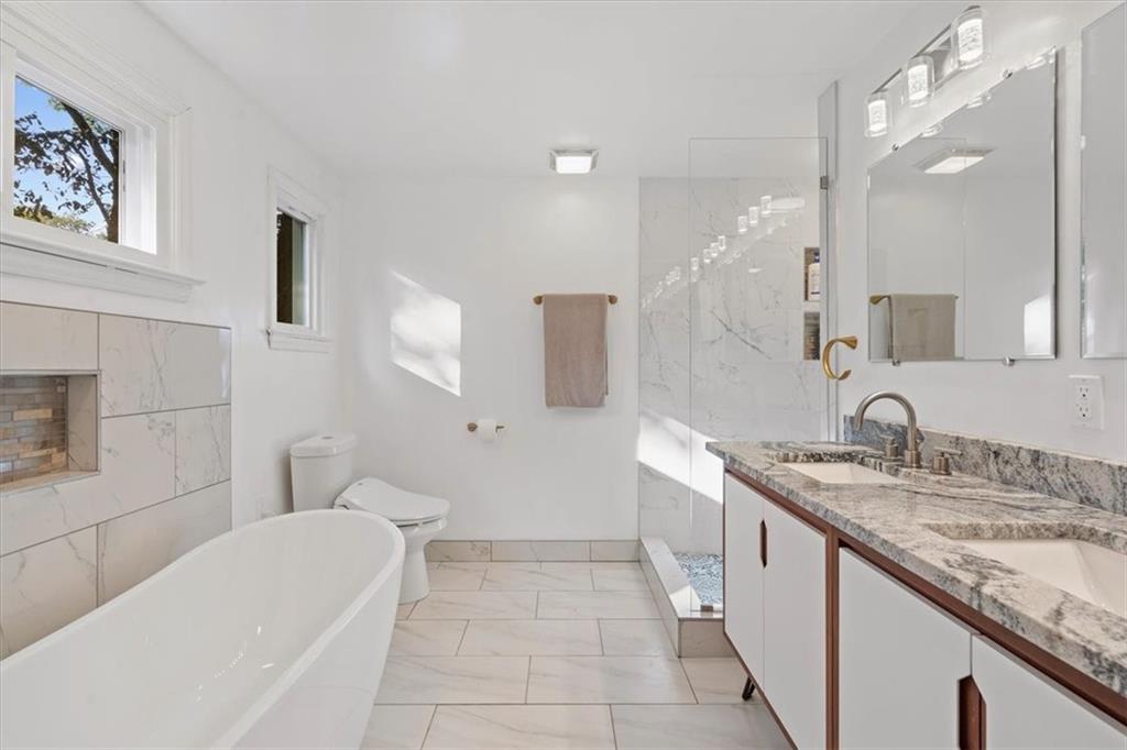2239 Old Washington Road Pittsburgh, PA 15241 - Photo 29 of 37 a bathroom with a granite countertop sink mirror and bathtub