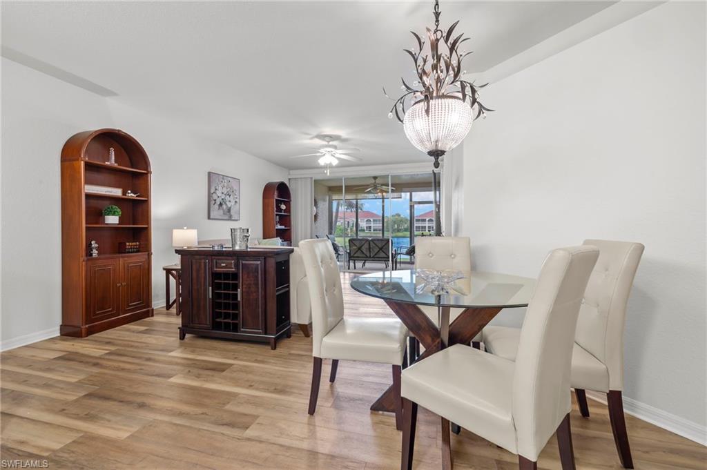 23821 Marbella Bay Road, Unit 102 Estero, FL 34135 - Photo 4 of 30 a view of a dining room with furniture