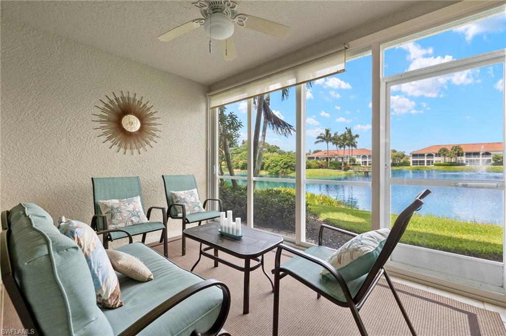 23821 Marbella Bay Road, Unit 102 Estero, FL 34135 - Photo 7 of 30 a living room with furniture and a floor to ceiling window