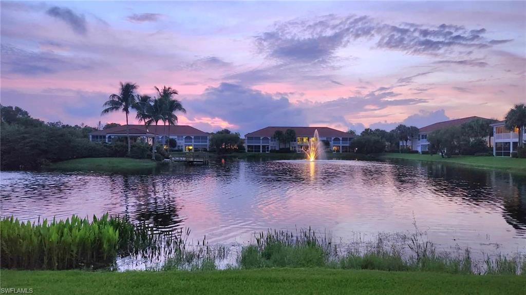 23821 Marbella Bay Road, Unit 102 Estero, FL 34135 - Photo 8 of 30 a lake view with a garden