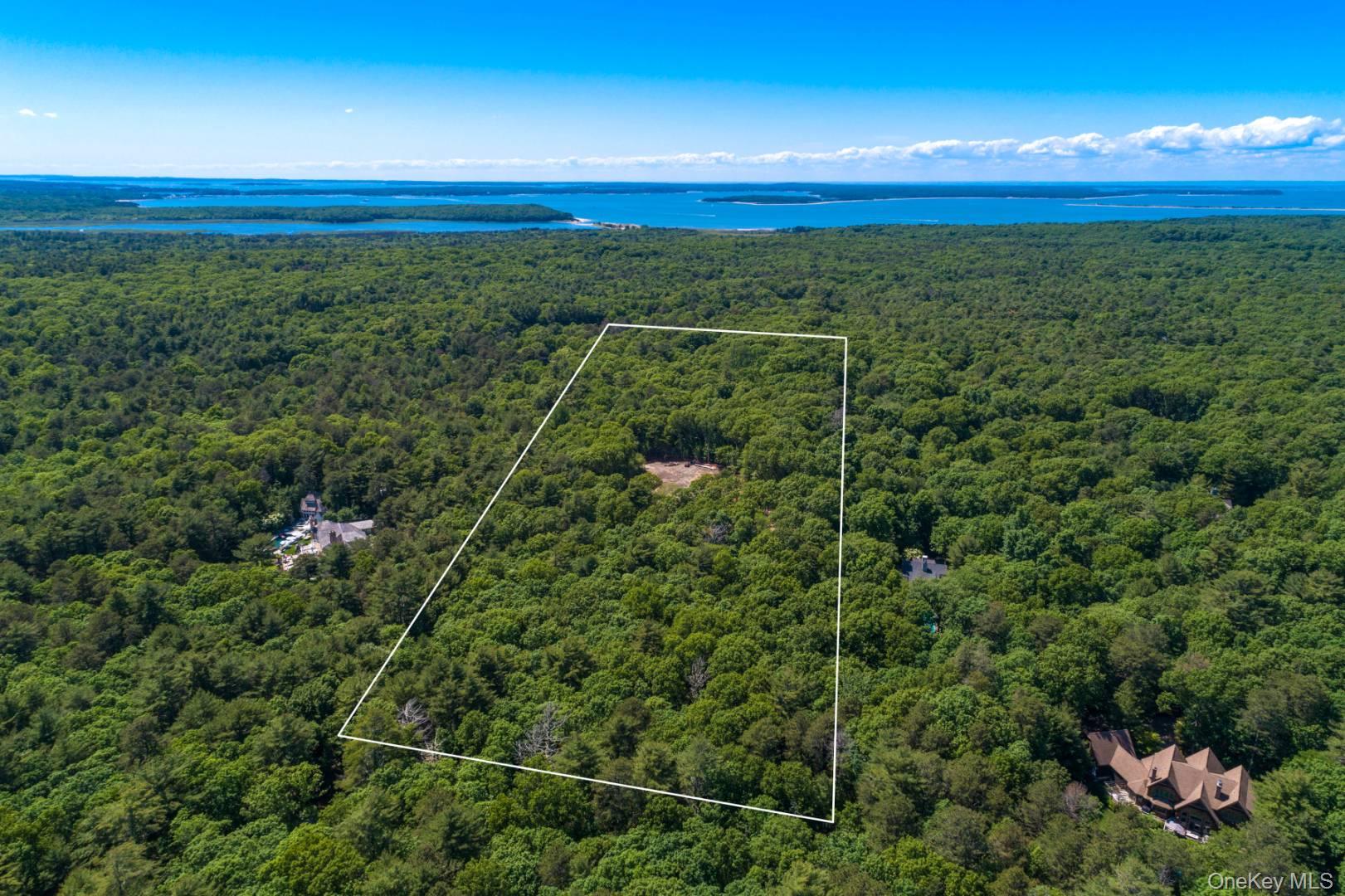 1593 Deerfield Road Water Mill, NY 11976 - Photo 3 of 9 Aerial view of property's location featuring property parcel outlined and a large body of water
