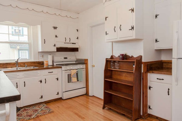 97 Bay State Road Worcester, MA 01606 - Photo 13 of 26 a kitchen with granite countertop white cabinets and stainless steel appliances