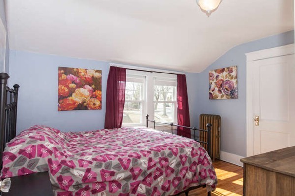 97 Bay State Road Worcester, MA 01606 - Photo 15 of 26 a bedroom with a large bed and a dresser