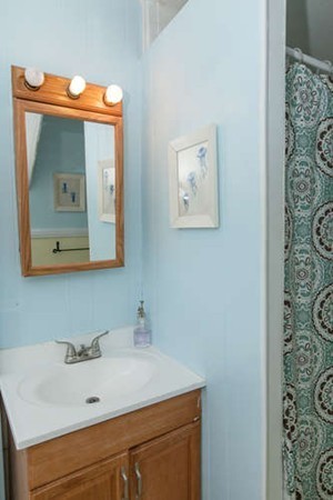 97 Bay State Road Worcester, MA 01606 - Photo 21 of 26 a bathroom with a sink and a mirror