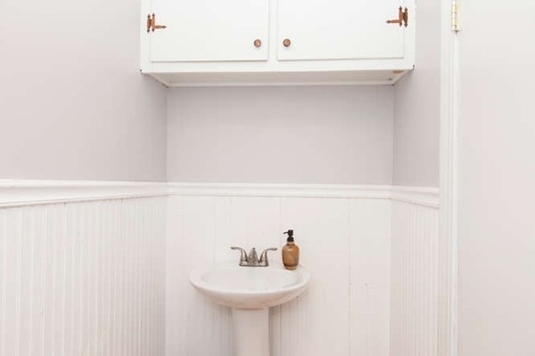 97 Bay State Road Worcester, MA 01606 - Photo 22 of 26 a bathroom with a sink and a mirror