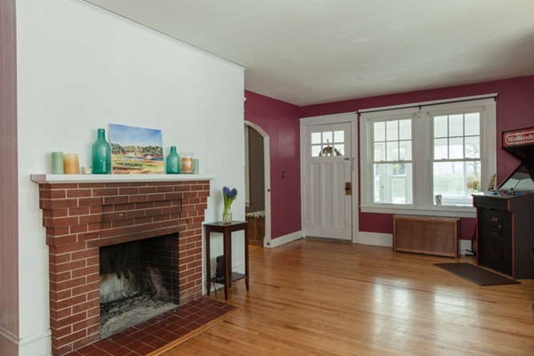 97 Bay State Road Worcester, MA 01606 - Photo 8 of 26 a living room with furniture and a fireplace