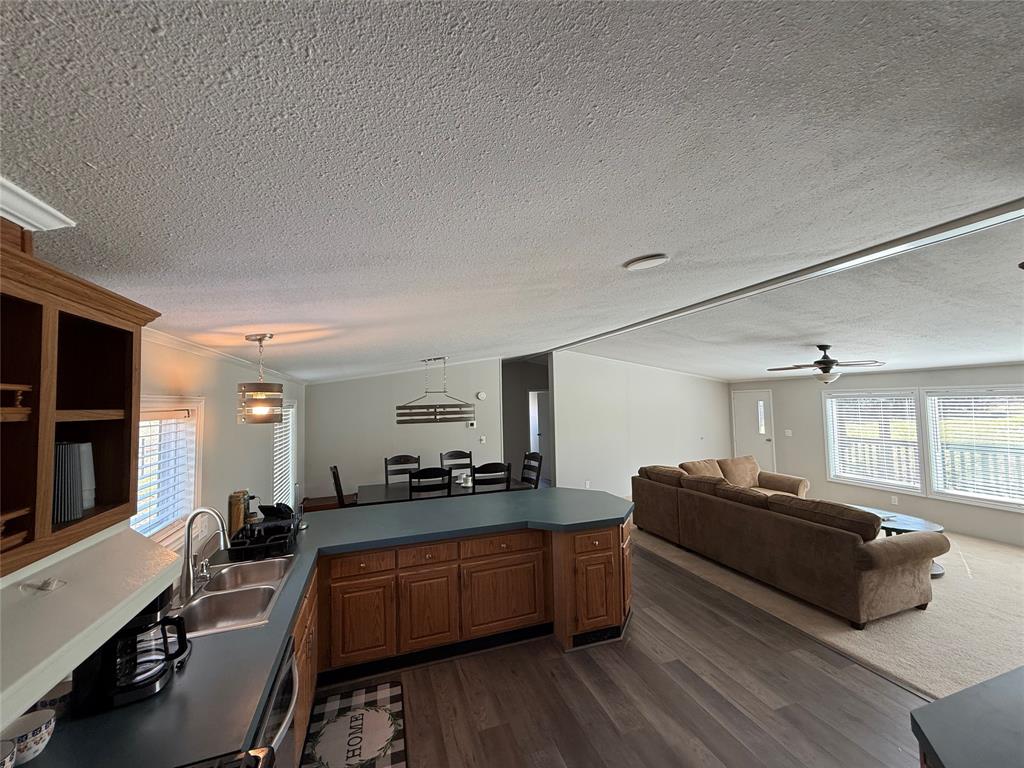 277 Oaks Crossing Road Mineral Wells, TX 76067 - Photo 12 of 25 a large bedroom with a bed and wooden floor