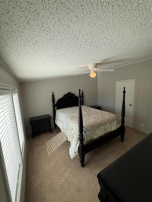 277 Oaks Crossing Road Mineral Wells, TX 76067 - Photo 20 of 25 a bedroom with a bed and a night stand