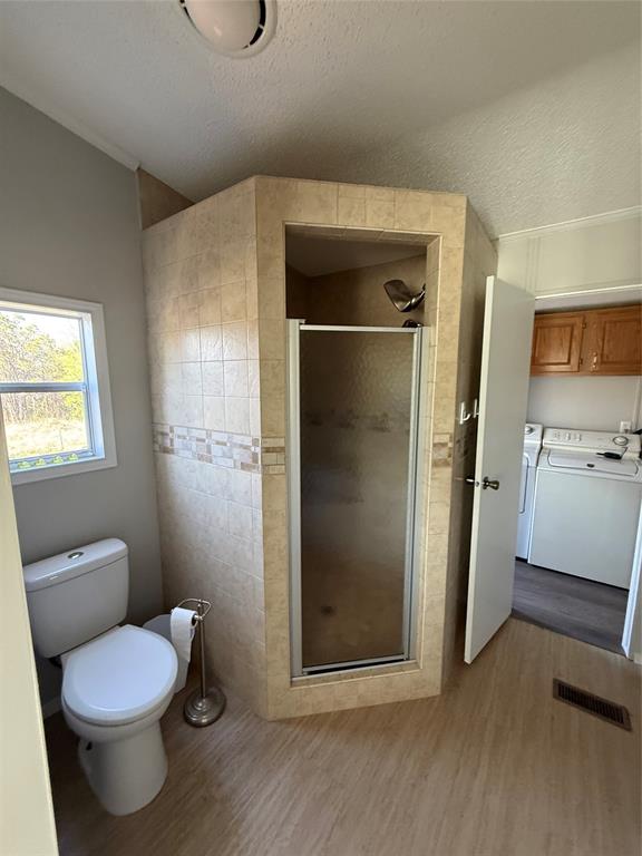 277 Oaks Crossing Road Mineral Wells, TX 76067 - Photo 21 of 25 a bathroom with a toilet and a shower
