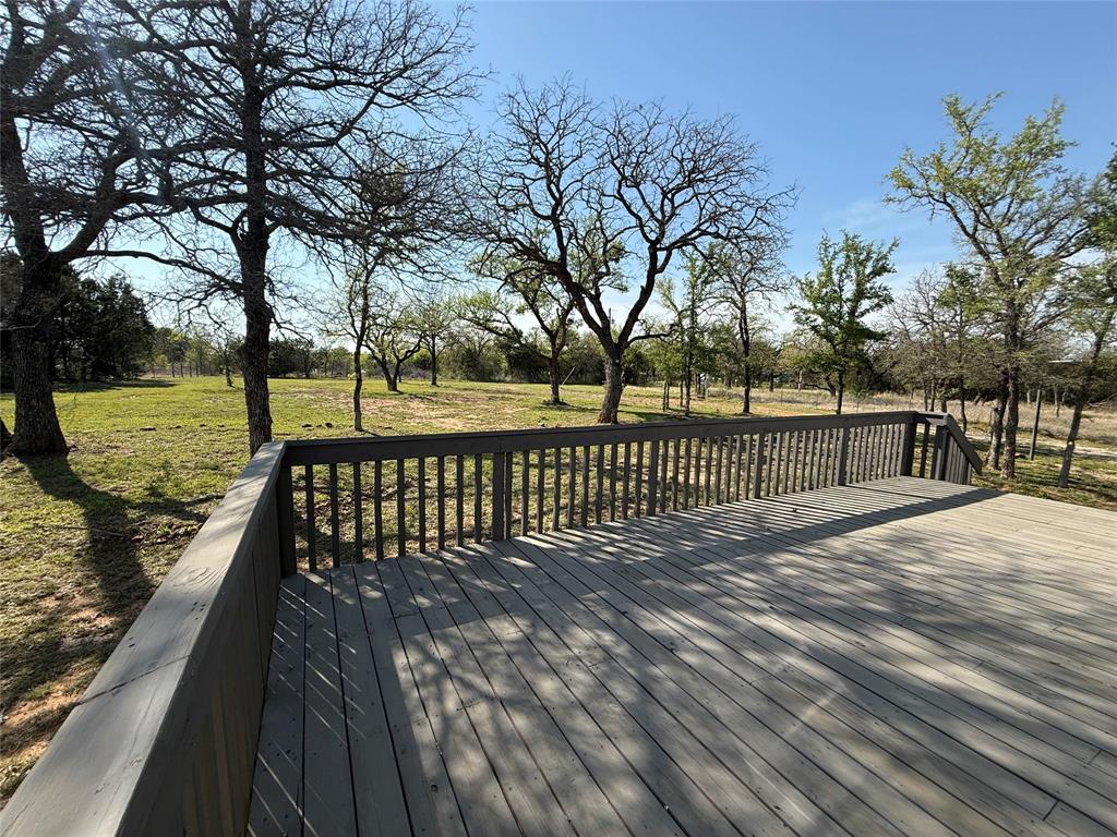 277 Oaks Crossing Road Mineral Wells, TX 76067 - Photo 24 of 25 a view of park with wooden floor next to a yard