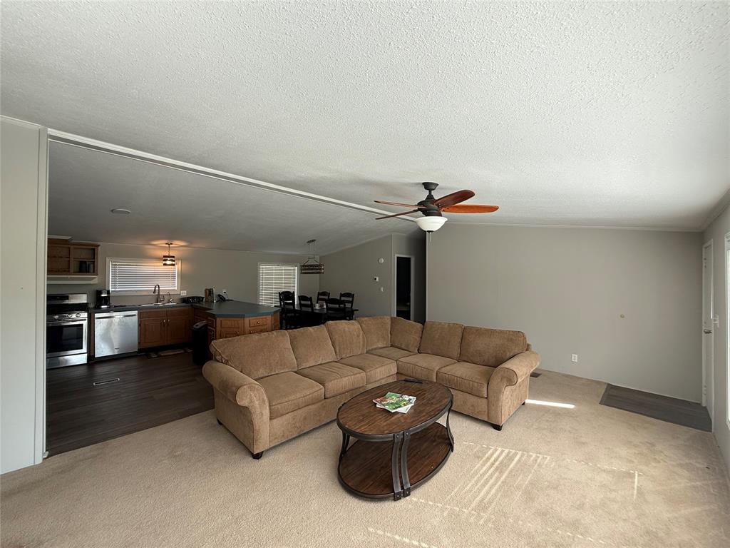 277 Oaks Crossing Road Mineral Wells, TX 76067 - Photo 6 of 25 a living room with furniture and kitchen view
