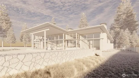 a view of a house with a yard covered in snow