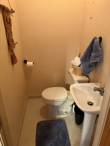 a bathroom with a toilet and a sink