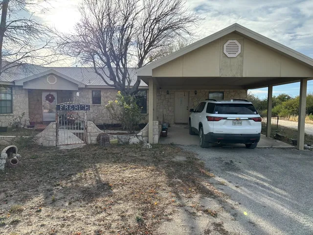 a car parked in front of a house