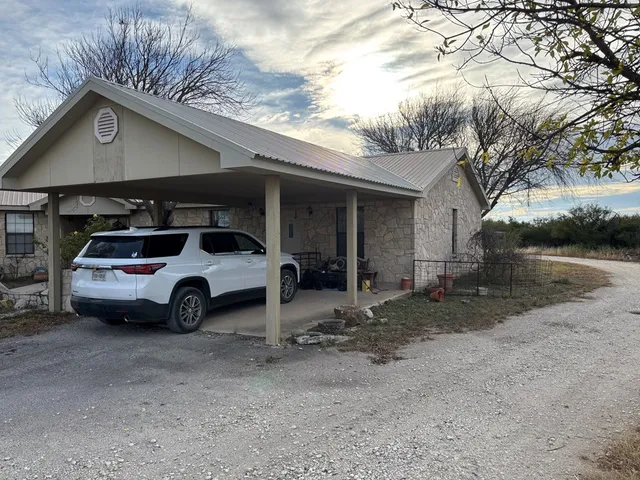 a view of car parked in front of house