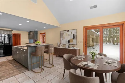 a view of a dining room with furniture window and outside view