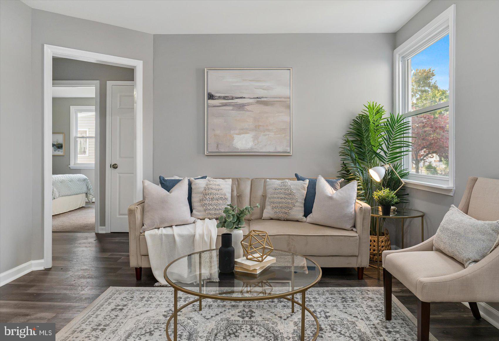 8217 Bullneck Road Baltimore, MD 21222 - Photo 1 of 41 a living room with furniture and wooden floor