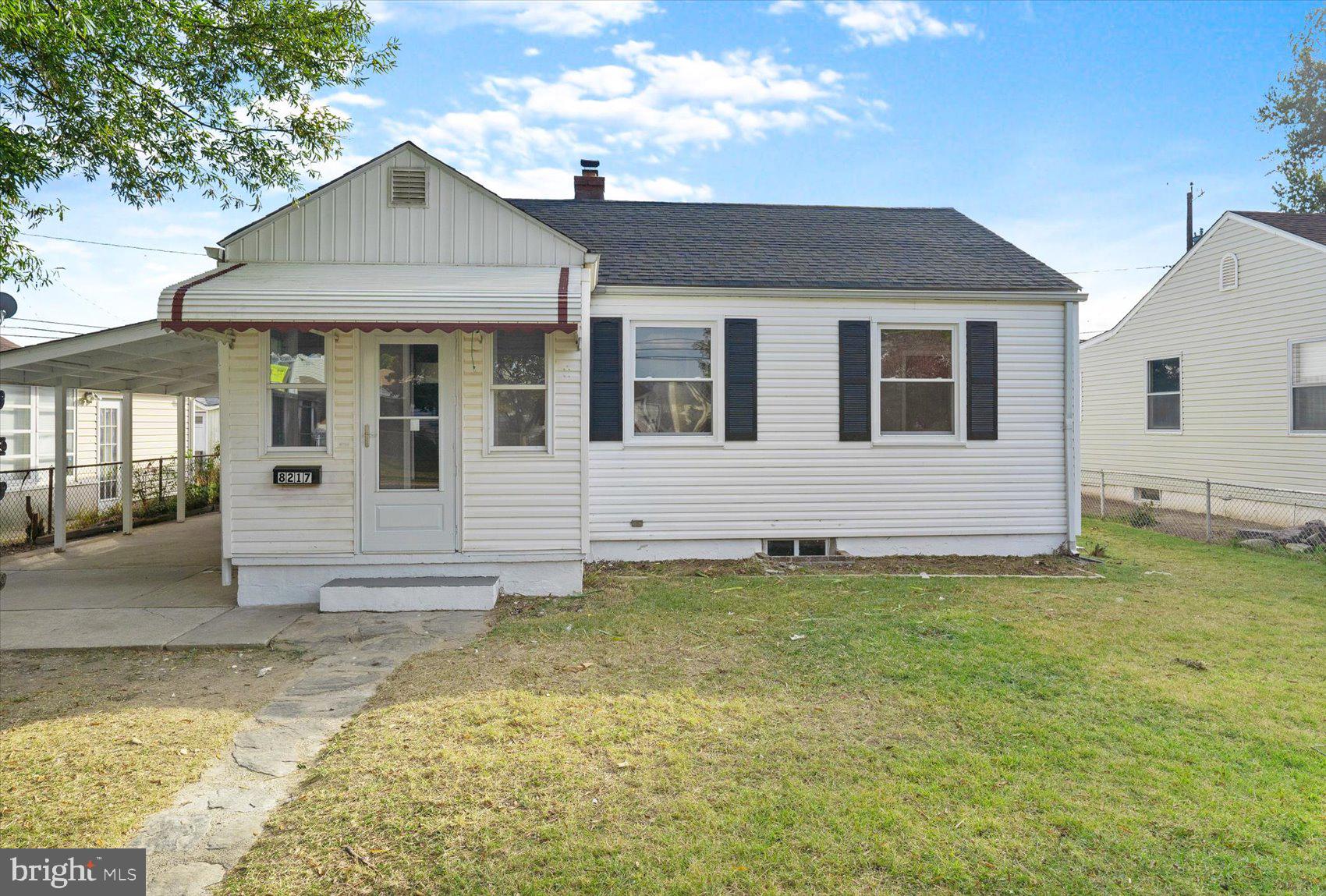 8217 Bullneck Road Baltimore, MD 21222 - Photo 2 of 41 a front view of a house with a yard
