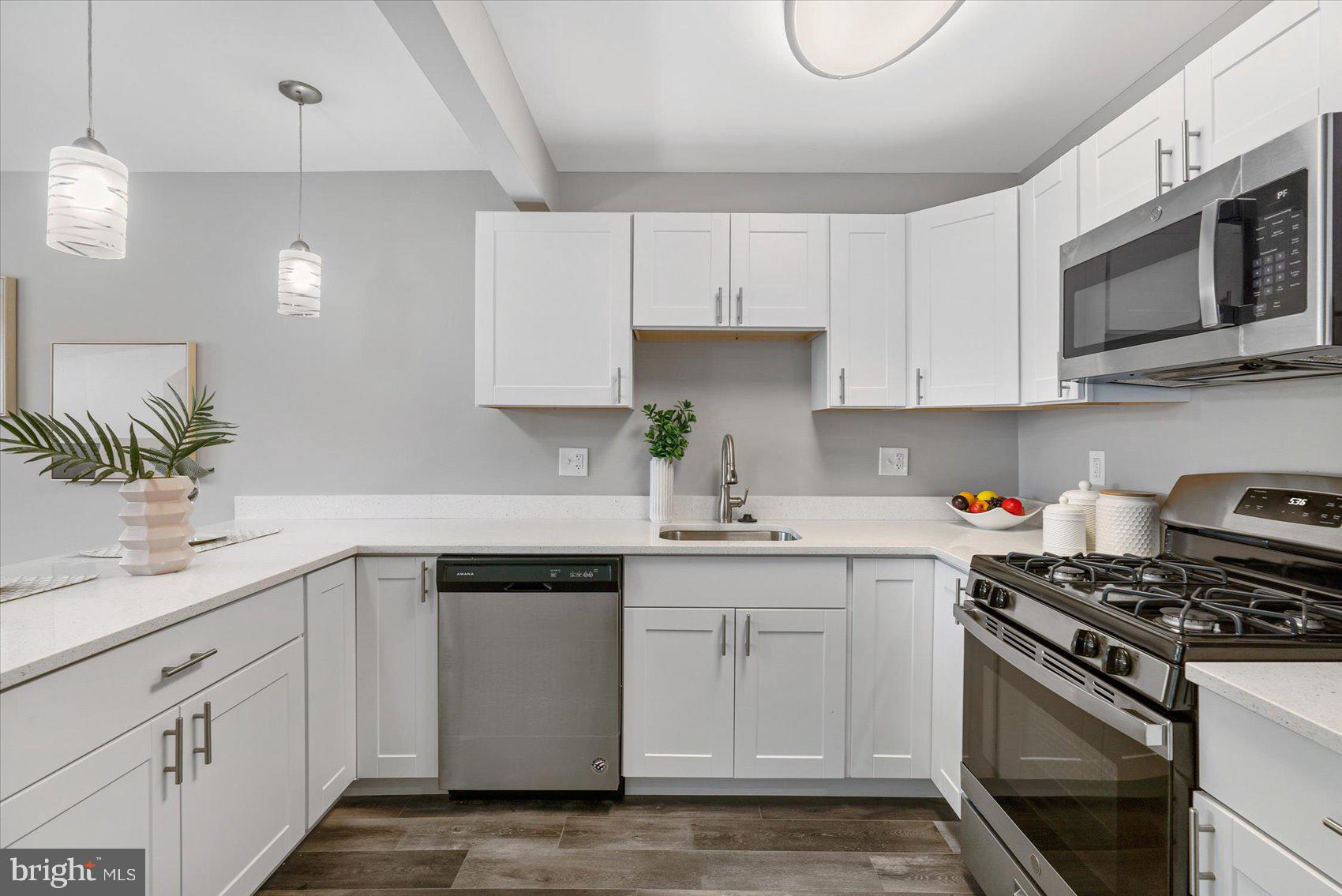 8217 Bullneck Road Baltimore, MD 21222 - Photo 12 of 41 a kitchen with cabinets stainless steel appliances and a sink