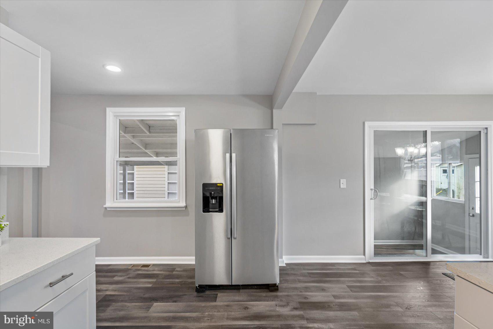 8217 Bullneck Road Baltimore, MD 21222 - Photo 15 of 41 an empty room with wooden floor and a window