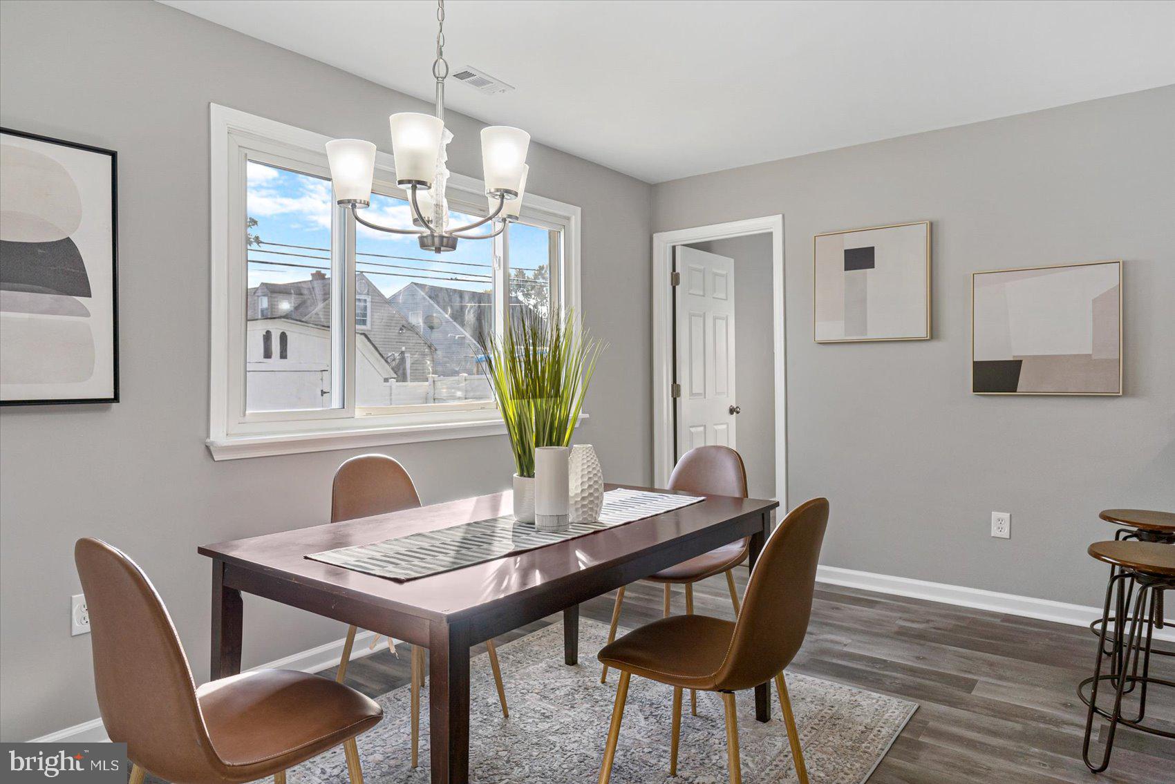 8217 Bullneck Road Baltimore, MD 21222 - Photo 17 of 41 a view of a dining room with furniture window and wooden floor