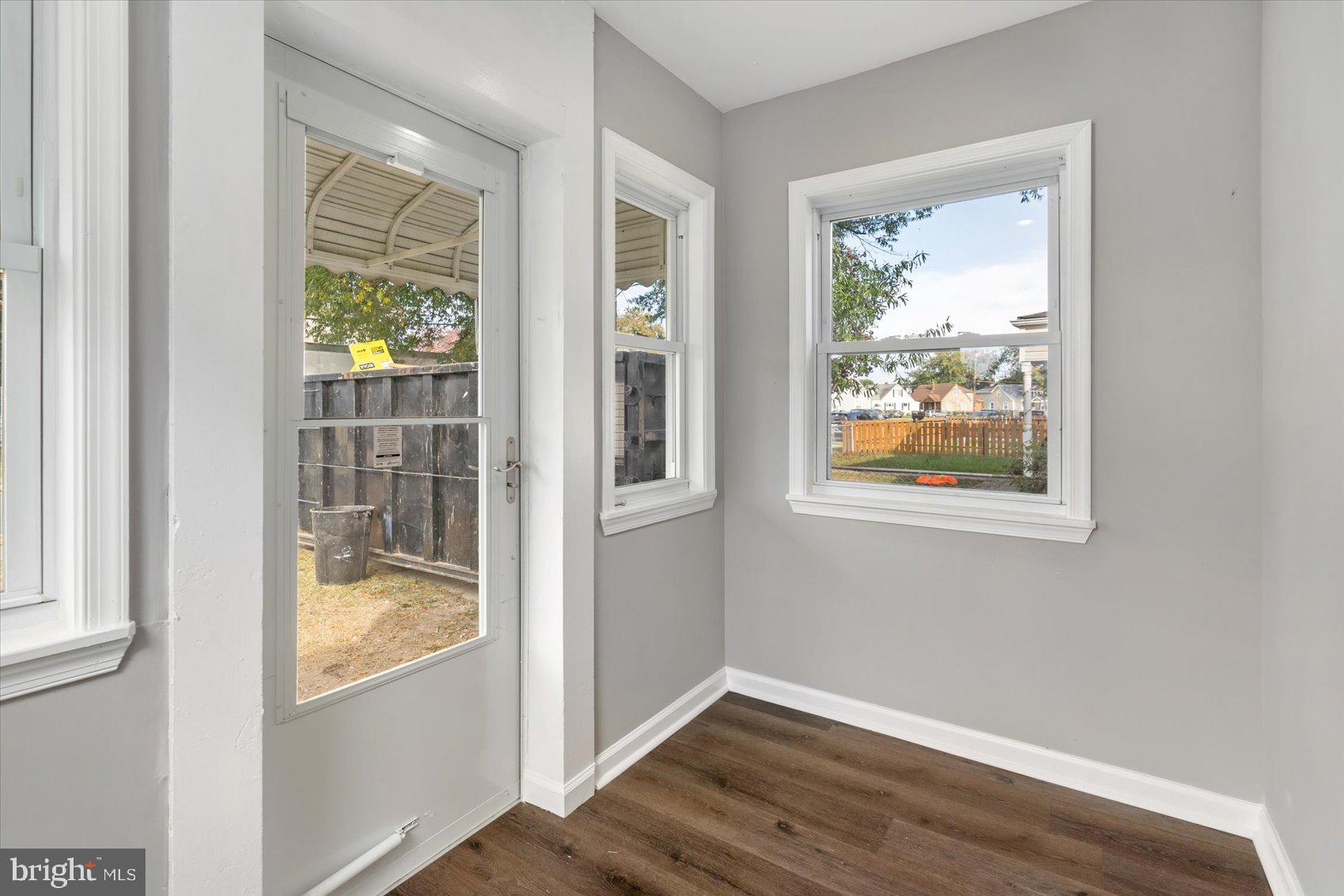 8217 Bullneck Road Baltimore, MD 21222 - Photo 20 of 41 an empty room with wooden floor and a window