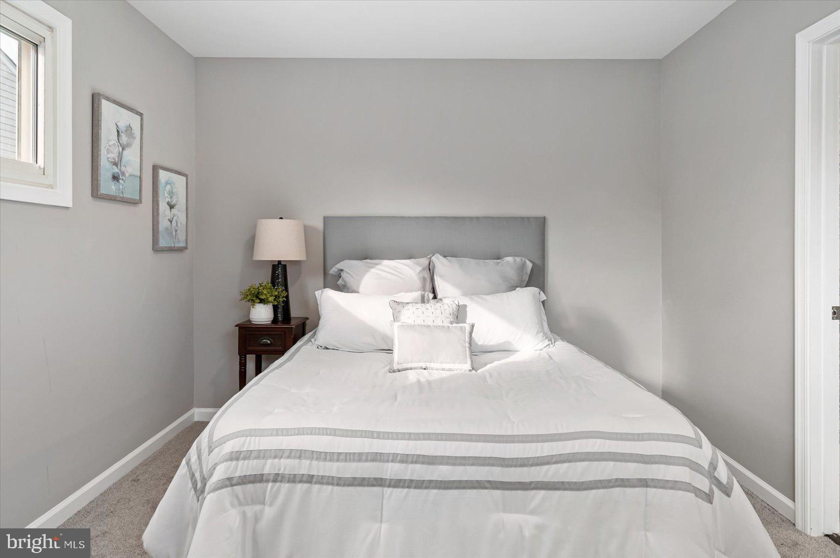 8217 Bullneck Road Baltimore, MD 21222 - Photo 21 of 41 a large white bed in a white room