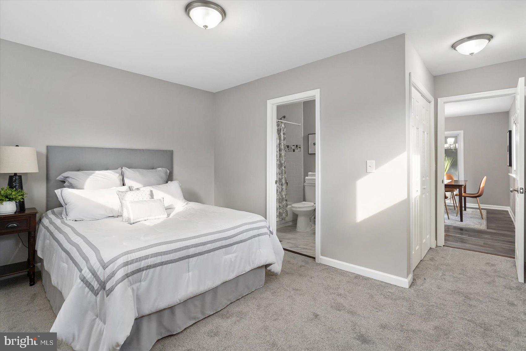8217 Bullneck Road Baltimore, MD 21222 - Photo 22 of 41 a bedroom with a bed and mirror