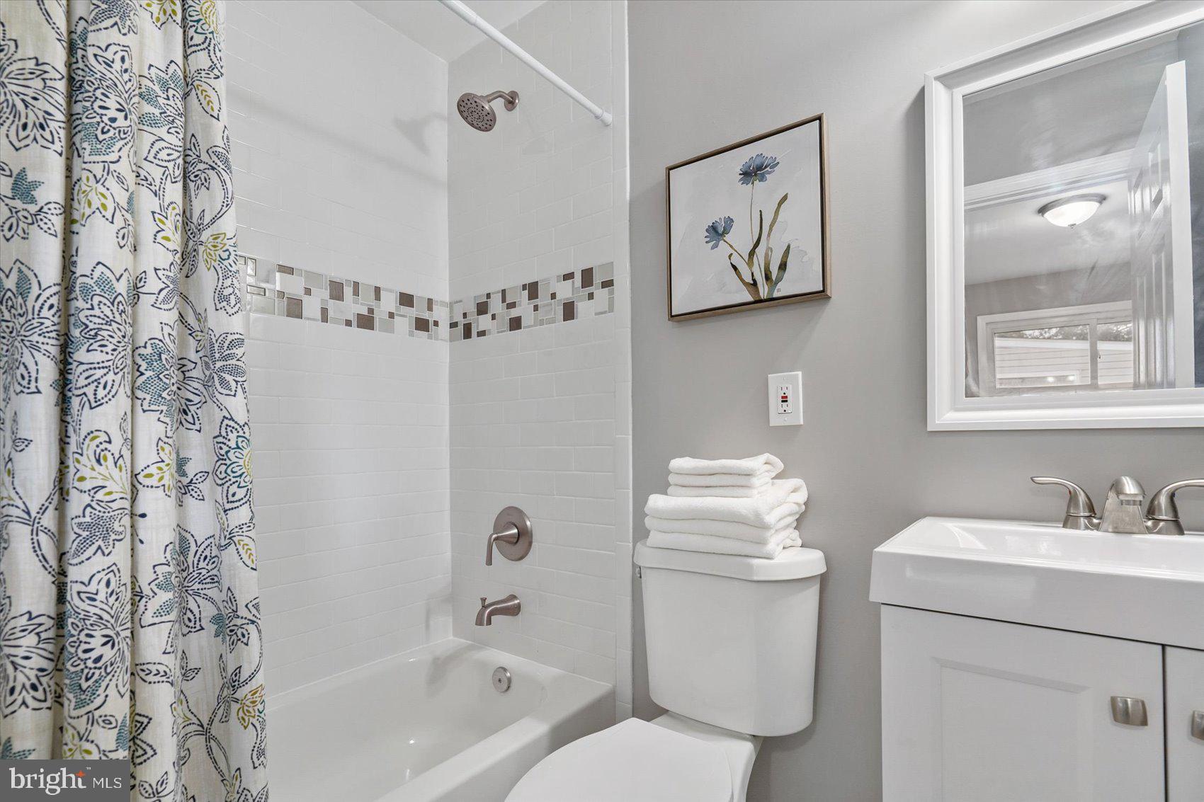 8217 Bullneck Road Baltimore, MD 21222 - Photo 25 of 41 a bathroom with a sink toilet and shower