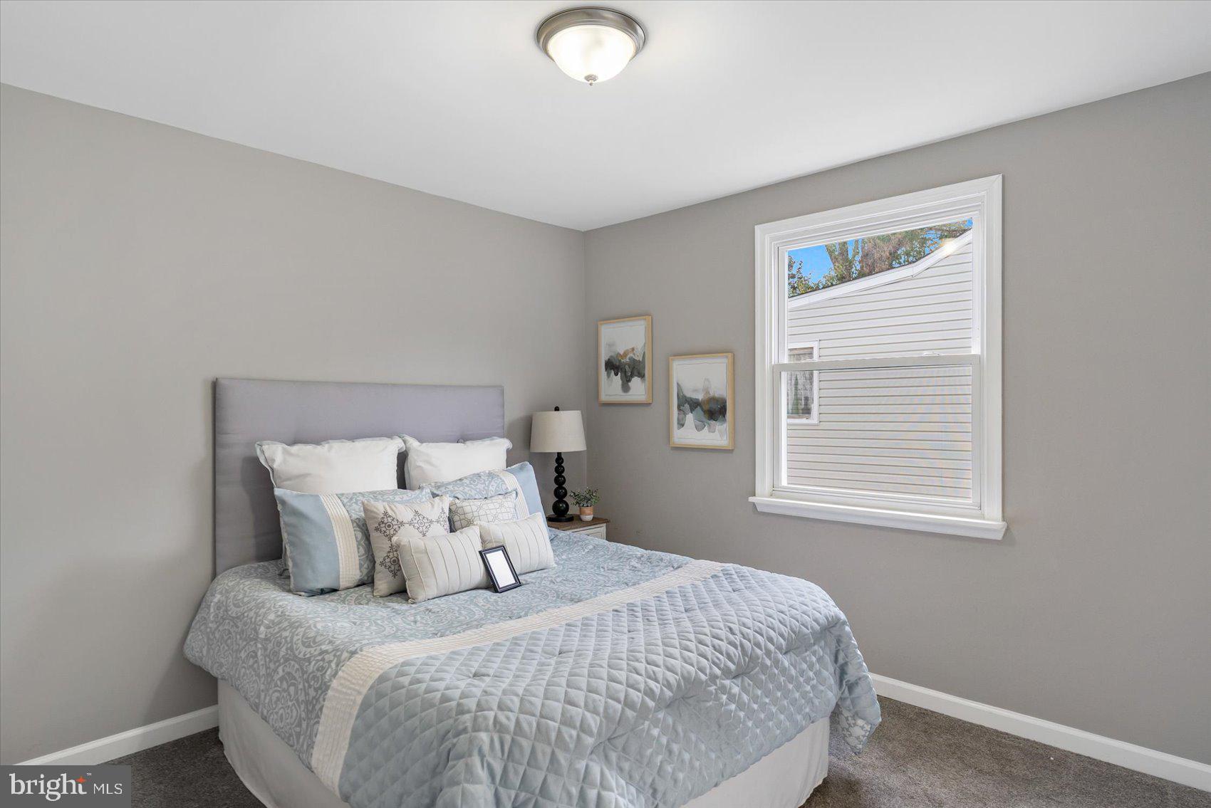 8217 Bullneck Road Baltimore, MD 21222 - Photo 27 of 41 a bedroom with a bed and a window