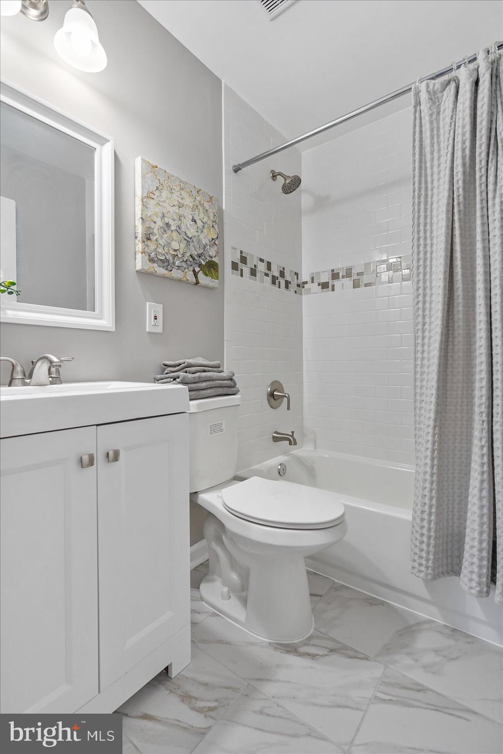 8217 Bullneck Road Baltimore, MD 21222 - Photo 29 of 41 a bathroom with a sink a toilet and shower