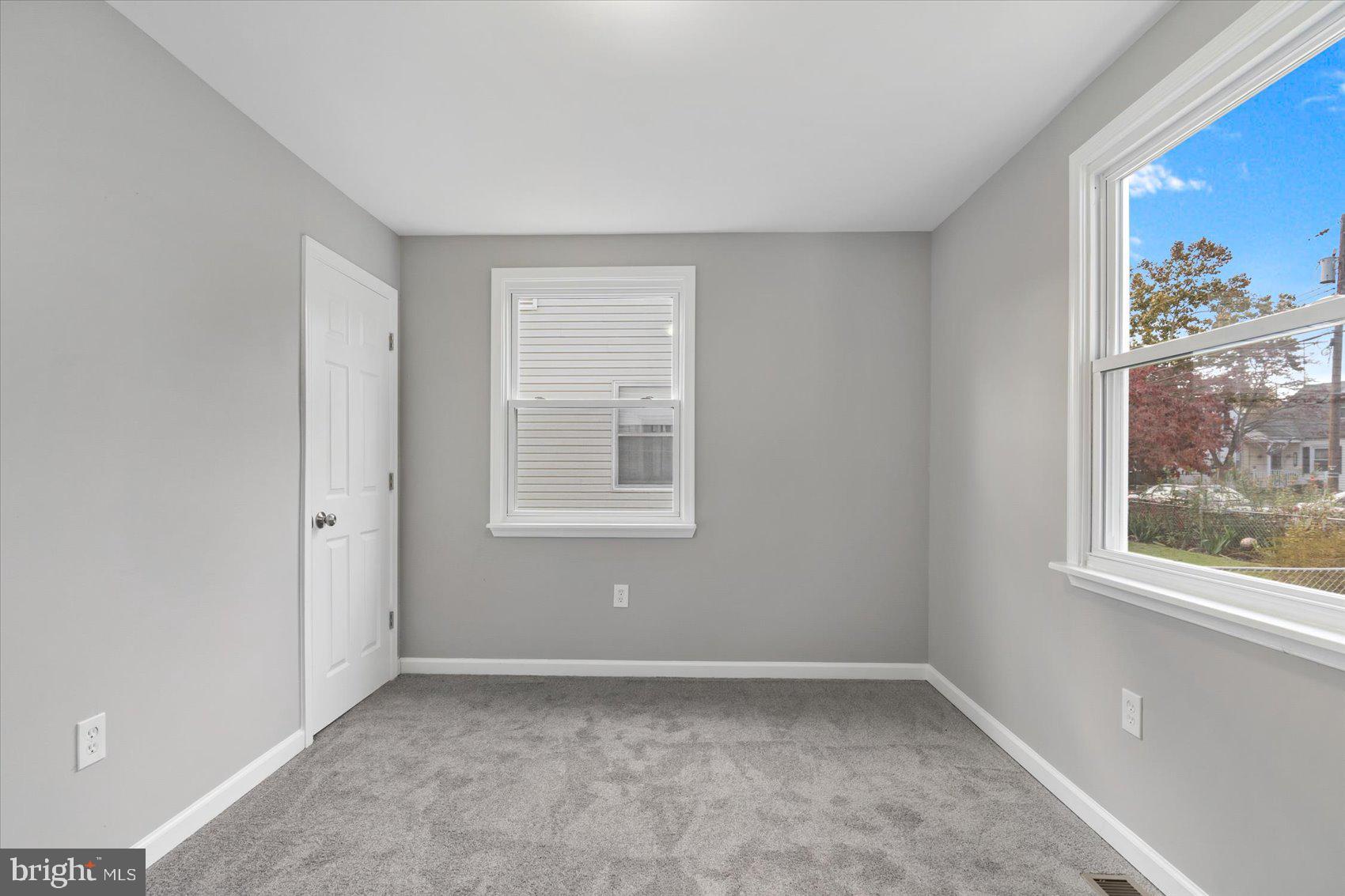 8217 Bullneck Road Baltimore, MD 21222 - Photo 31 of 41 a view of an empty room with a window